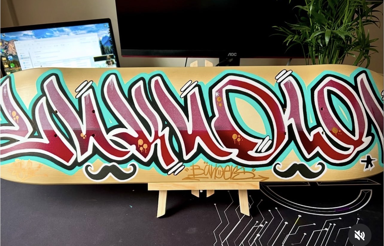 Red and turquoise graffiti custom skateboard